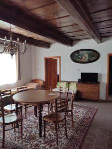 a living room with a table and chairs and a couch at Rodinné apartmány Country golf club Střítež in Třebíč