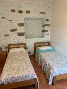 Postel nebo postele na pokoji v ubytování I Limoni 3