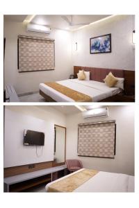 A bed or beds in a room at Hotel Abhilasha inn