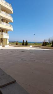 an empty parking lot in front of a building at Studio Sarafovo in Burgas City