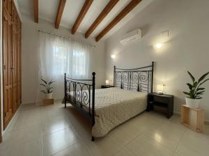Posteľ alebo postele v izbe v ubytovaní Villa Casa Dalí