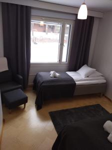 Postel nebo postele na pokoji v ubytování Asuntos-1