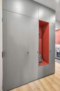 a room with a large white cabinet in a kitchen at Sea Moreto Apartment 2 in Burgas City