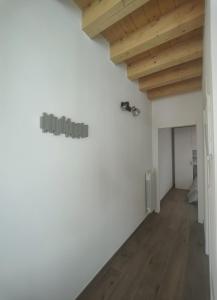 a room with white walls and a wooden ceiling at Parsifal House in Chioggia +24 photos