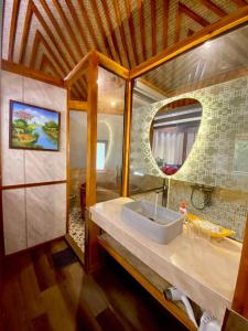 a bathroom with a sink and a mirror at SaPa Sinai Homestay in Sa Pa