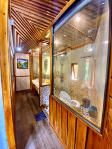 a room with a bathroom with a sink and a mirror at SaPa Sinai Homestay in Sapa