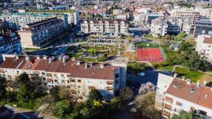 an aerial view of a city with a tennis court at Apartment Kosta in Podgorica