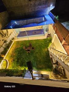 an overhead view of a garden with a table and chairs at SYED FAMILY REST HOUSE in Karachi