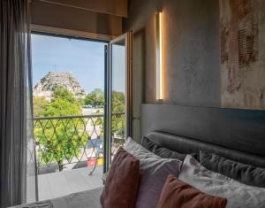 Postel nebo postele na pokoji v ubytování Arcadion Hotel