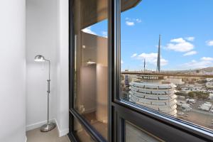 a window in a room with a view of a city at Skyview 2 Bedroom Penthouse in Los Angeles