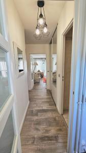 a hallway of a home with a tile floor at Studio tout confort gare de Lyon - possibilité parking in Paris