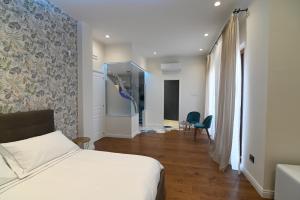 Postel nebo postele na pokoji v ubytování Slopes Suites and SPA