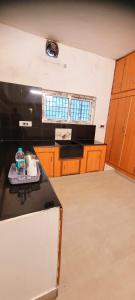Kuchyň nebo kuchyňský kout v ubytování Black Pepper Cottage Yercaud