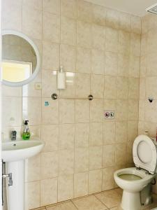 a bathroom with a toilet and a sink at Casa BB&Djassi in Ponta do Sol