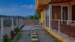 a porch of a house with two chairs on it at Horizon in Ureki