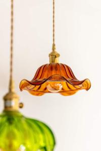 a close up of a chandelier with a green bottle at Deluxe apartment suite with terrace in Antwerp