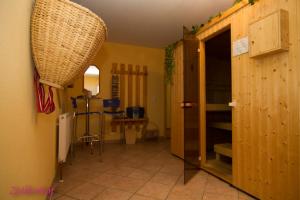 a hallway with a door to a room with a table at Zellerhof in Finkenberg