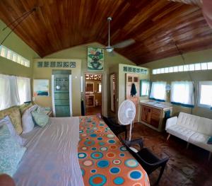 a bedroom with a large bed in a room at 'Crows Nest' Studio Apt. in Big Corn Island