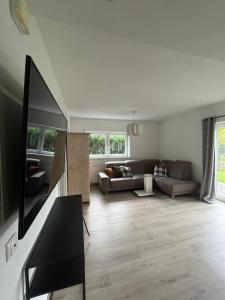 a living room with a couch and a table at Apartment Ida in Viereth-Trunstadt