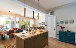 a kitchen and a living room with a dining room at House with pool Garden in Žrnovnica