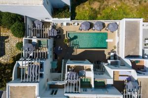 an aerial view of a house with a swimming pool at Vammos Luxury Apartments in Naousa