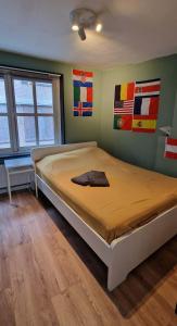 Кровать или кровати в номере Woonhuis Bergen op Zoom