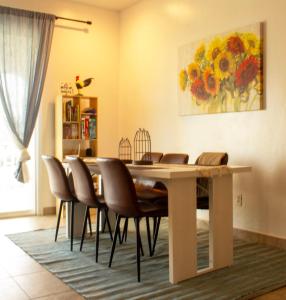 a dining room with a table and chairs at The Sunflower Villa in Grand Turk