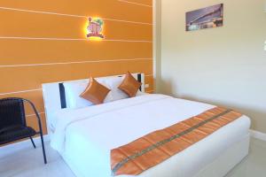 Ένα ή περισσότερα κρεβάτια σε δωμάτιο στο Phuket Andaman Place ภูเก็ตอันดามันเพลส