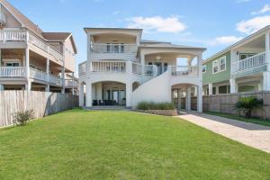 a row of apartment buildings with a yard at High Hopes on the bay! in San Leon