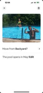 un hombre está jugando en una piscina en Adirondack Retreat, en Bakers Mills