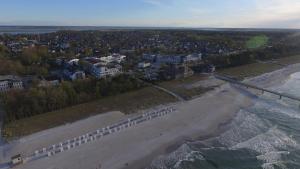 an aerial view of a beach with buildings and the ocean at ZingstUrlauber in Zingst