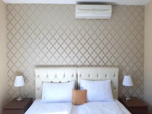 Ένα ή περισσότερα κρεβάτια σε δωμάτιο στο Trendy Deluxe Apartments