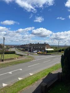 an empty road with a house on the side of the road at Olympic Place 1-bed Apartment in Rowley Regis