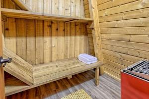 a wooden sauna with two towels sitting on a bench at Near Downtown Helen - HotTub, Sauna, Game Room, Fire Pit in Helen