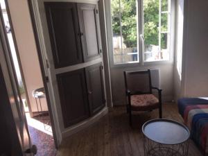 a living room with a couch and a chair at Maison bord de mer in La Tranche-sur-Mer