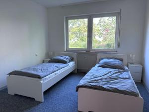 Cama ou camas em um quarto em Unterkunft nähe Frankfurt für 4 Personen