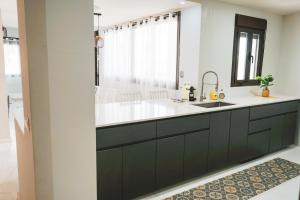 a bathroom with a sink and a mirror at Casa Topacio Luxury Villa, 3 bedrooms sleeps 8 in Mijas
