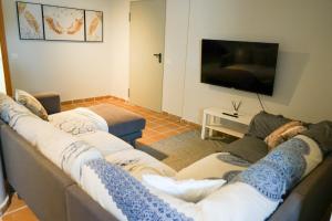 a living room with two couches and a flat screen tv at Casa Topacio Luxury Villa, 3 bedrooms sleeps 8 in Mijas
