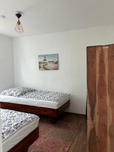 Postel nebo postele na pokoji v ubytování Hus Dunya