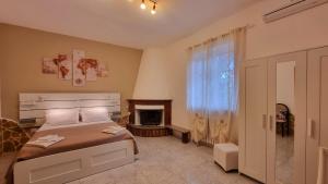 a bedroom with a bed and a fireplace at Il Trulletto in Impalata