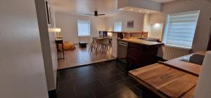 a kitchen and a living room with a table at Bel appartement rénové avec de beaux volumes in Flavigny-sur-Moselle +35 photos