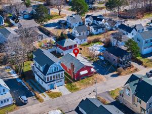 an aerial view of a residential neighborhood with a red sign at Seaside Serenity: Charming 2BR Escape - Parking in Scarborough