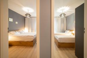 Posteľ alebo postele v izbe v ubytovaní 3D Spring Apartments Krakow