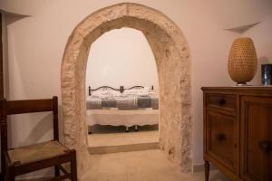 Postel nebo postele na pokoji v ubytování Trullo Masiello
