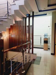 a lobby with a staircase in a building at Dream home 2 & 4 bedroom Family house in Karachi
