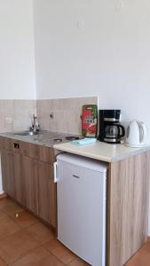 a kitchen with a counter with a coffee maker on it at Bonisis Studios in Laganas