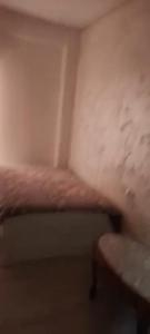 a small room with a bed and a table at Juan in Carlet