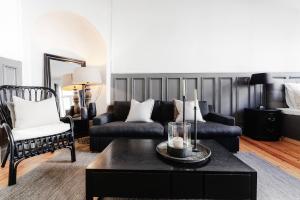 a living room with a couch and a coffee table at Oslo Vest in Oslo