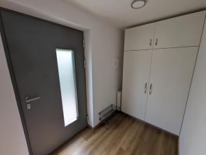 an empty room with a door and a window at Studio apartment Velis in Radovljica