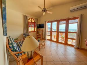 a living room with a view of the ocean at Ritz Empress in San Juan del Sur